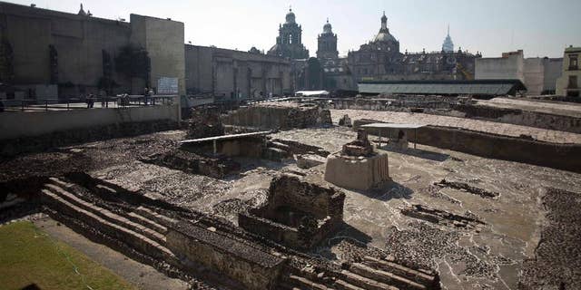 File photo - Tourists visit the Templo Mayor archaeological site in Mexico City, Tuesday Dec. 1, 2015.