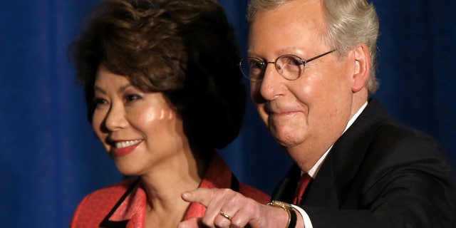 U.S. Senate Republican Leader Sen. Mitch McConnell and his wife Elaine Chao on May 20, 2014 in Louisville, Kentucky.