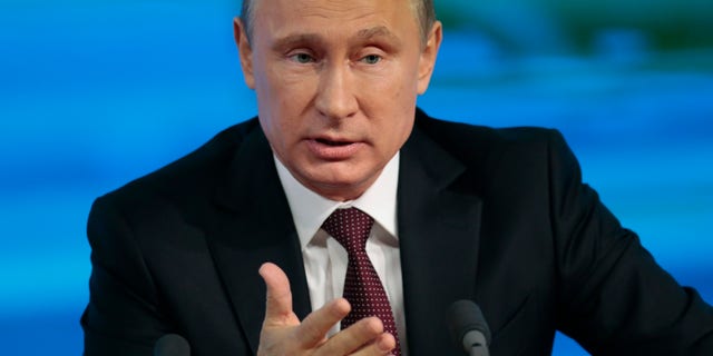 Russian President Vladimir Putin speaks at his annual news conference in Moscow, Russia, Thursday, Dec. 19, 2013. (AP Photo/Ivan Sekretarev)