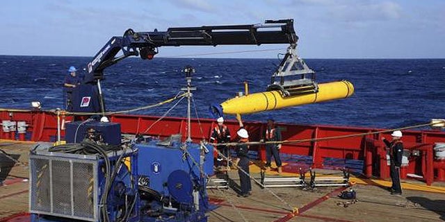 The Bluefin 21, the Artemis autonomous underwater vehicle (AUV), is hoisted back on board the Australian navy's Ocean Shield in the southern Indian Ocean. (U.S. Navy)