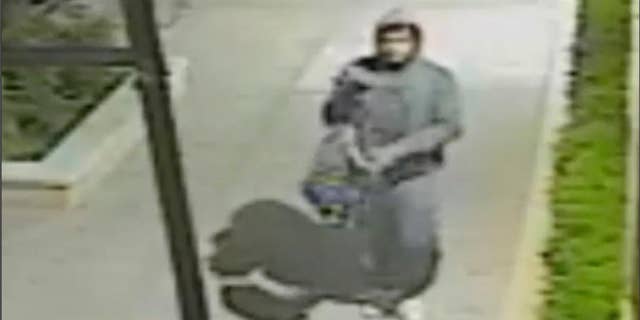 This image made from undated surveillance video provided by the New York City Police Department on Friday, May 5, 2017 shows a man who beat and sexually assaulted a German tourist in an attack caught on video around 3 a.m. Thursday. The woman was walking along West 146th Street in Harlem to rental accommodations. The video captured the man yanking away the woman's bag, punching her in the head and repeatedly hitting her as she lies on the ground. (New York City Police Department via AP)