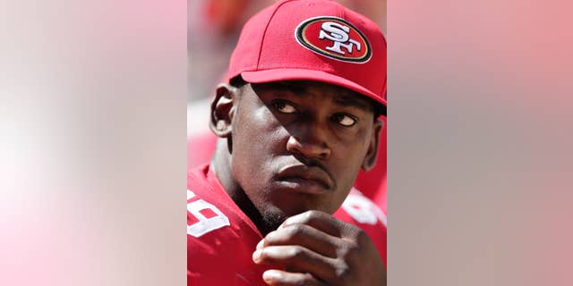 File - In this Aug. 24, 2014, file photo, San Francisco 49ers linebacker Aldon Smith sits on the sideline during the second half of an NFL preseason football game against the San Diego Chargers in Santa Clara, Calif. Smith has missed 14 games in the past two seasons, including the first nine this year serving his supsension for violations of the NFL's substance-abuse and personal-conduct policies. Now, the star San Francisco linebacker is likely to make his 2014 debut Sunday, Nov. 16, at the New York Giants hoping to regain the form that made him one of the league's fiercest and dominant pass rushers. (AP Photo/Marcio Jose Sanchez, File)