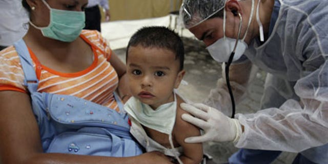 June 2, 2009: A doctor checks on a child suspected of having H1N1 at a mobile clinic in the Children's Hospital in Nicaragua.