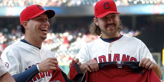 Cleveland Indians manager Manny Acta, shortstop Asdrubal Cabrera and relief pitcher Chris Perez at a presentation before their game against the Toronto Blue Jays in Cleveland on Saturday, July 9, 2011.