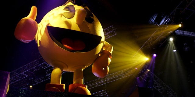 File photo: Pac-Man sits atop a display for video game maker Namco at the E3 Convention at the Los Angeles Convention Center, May 19, 2005. The giants in the $10 billion video gaming industry wrap up their annual meeting May 20, 2005. (REUTERS/Sam Mircovich)