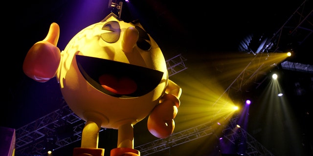 File photo: Pac-Man sits atop a display for video game maker Namco at the E3 Convention at the Los Angeles Convention Center, May 19, 2005. The giants in the $10 billion video gaming industry wrap up their annual meeting May 20, 2005. (REUTERS/Sam Mircovich)