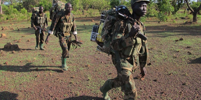 April 19, 2012: Ugandan soldiers hunting for fugitive warlord Joseph Kony deep in the Central African Republic jungle patrol the area. For Ugandan soldiers tasked with catching Joseph Kony, the real threat is not the elusive Central Africa warlord and his brutal gang. Encounters between Ugandan troops and Lord's Resistance Army rebels are so rare that the Kony hunters worry about other things when they walk the jungle: armed poachers, wild beasts, honey bees, and even a widely-ranging fly that torments their ears during day.