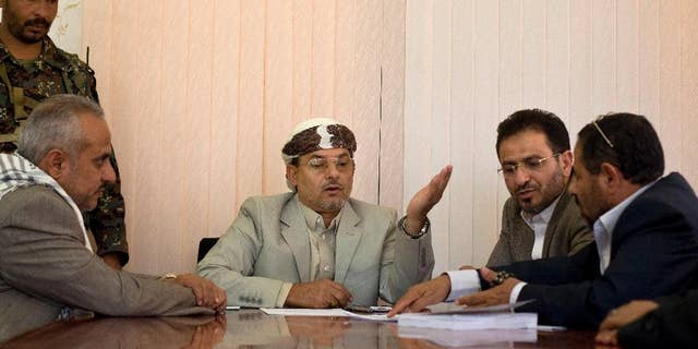 Yahya al-Houthi, center, brother of Houthi leader, Abdel-Malek al-Houthi attends a meeting at parliament in Sanaa, Yemen, Monday, Feb. 9, 2015. Yemen's Shiite rebels are meeting with political rivals for the first time since cementing their power grab last week by dissolving parliament and making their top security body the de facto government. (AP Photo/Hani Mohammed)