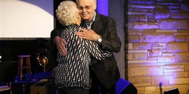 George Jones hugs Jean Shepard after inducting her into the Country Music Hall of Fame during the private Medallion Ceremony at The Country Music Hall of Fame and Museum in Nashville, Tenn. on Sunday, May 22, 2011.