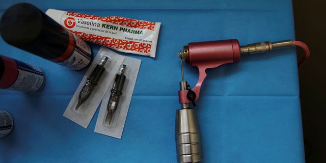 A file image shows a pink tattoo machine that symbolizes the fight against breast cancer, March 23, 2017.