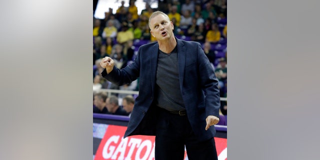 TCU head coach Jeff Mittie gestures from the sideline during the first half of an NCAA college basketball game against the Baylor Saturday, Feb. 22, 2014, in Fort Worth, Texas. (AP Photo/LM Otero)