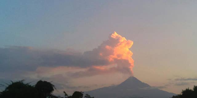 Steam and ash rises from the Colima volcano Friday, Oct. 30, 2016. Eruptions at the Colima volcano in western Mexico have led authorities to evacuate two small hamlets on the volcano’s slopes. The government of the state of Colima said 230 people had been evacuated from the hamlet of La Becerra and 80 from Yerbabuena. Civil defense officials said some went to a shelter in the town of Comala. (AP Photo/Dario Lopez-Mills)