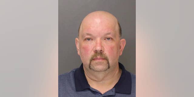 This May 2016 booking photo provided by the Lehigh County DUI Processing Center shows Michael Horvath of Saylorsburg, Pa. Horvath was arrested Thursday, Oct. 13, 2016, after investigators say they found a bone on his property matching the DNA of Holly Grim, a woman last seen in November 2013 who was a co-worker of Horvath at a church organ manufacturer. (Lehigh County DUI Processing Center via AP)