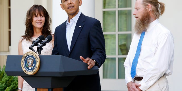 President Obama stands with Bob Bergdahl (R) and Jami Bergdahl (L) as he delivers a statement about the release of their son, prisoner of war U.S. Army Sergeant Bowe Bergdahl, in the Rose Garden at the White House in Washington May 31, 2014.