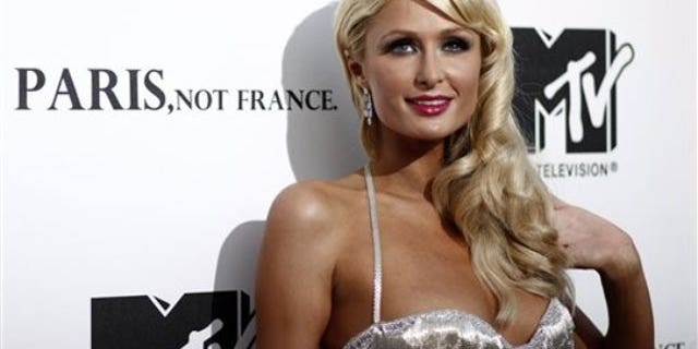 Paris Hilton is being sued by a fake hair company who pays her as a spokeswoman after she was spotted in a competitor's weave.