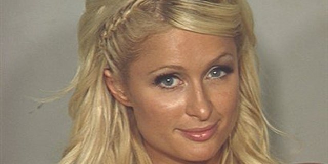 In this photo released Saturday, Aug. 28, 2010 by the Las Vegas Metropolitan Police Department, Paris Hilton is seen in her police booking photo in Las Vegas.