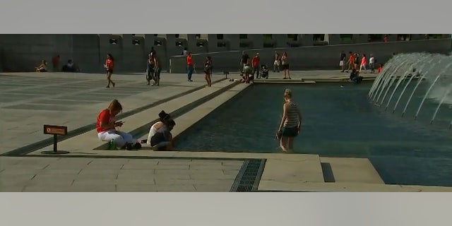 July 2016: Visitors to the National World War II Memorial, Washington, D.C. Fox 5 News
