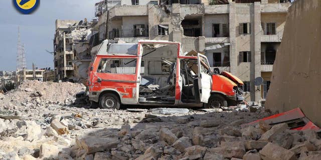 Sept. 23, 2016: In this photo provided by the Syrian Civil Defense group known as the White Helmets, a destroyed ambulance is seen outside the Syrian Civil Defense main center after airstrikes in Ansari neighborhood in the rebel-held part of eastern Aleppo, Syria.