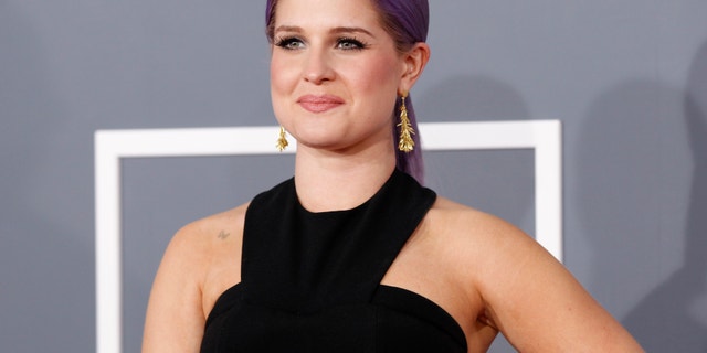 Television personality Kelly Osbourne arrives at the 55th annual Grammy Awards in Los Angeles, California February 10, 2013.