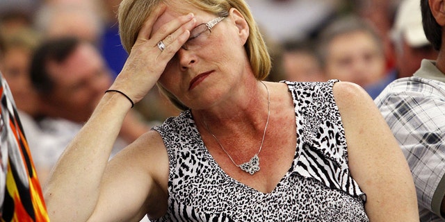 March 28: Brenda Guidry, of Larose, La. holds her head in frustration during a public meeting with BP claims fund administrator, Ken Feinberg