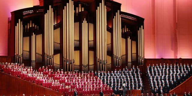 In this Oct. 1, 2016, file photo, the Mormon Tabernacle Choir of The Church of Jesus Christ of Latter-day Saints sings in the Conference Center at the morning session of the Mormon church conference in Salt Lake City. 