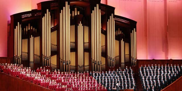 In this Oct. 1, 2016, file photo, the Mormon Tabernacle Choir of The Church of Jesus Christ of Latter-day Saints sings in the Conference Center at the morning session of the Mormon church conference in Salt Lake City.