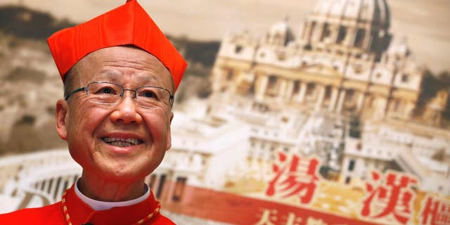 FILE - In this March 2, 2012 file photo, newly-selected Cardinal John Tong speaks to the media in Hong Kong. The head of the Catholic church in Hong Kong has expressed optimism that the Vatican and Beijing can overcome the controversial issue of bishop appointments lying at the core of a decades-long dispute. Tong said in a lengthy essay published by the Hong Kong diocese that a "preliminary consensus has reportedly been reached" on the matter, and suggested that the pope could retain veto power over the ordination of mainland bishops under the new arrangement.(AP Photo/Kin Cheung, File)