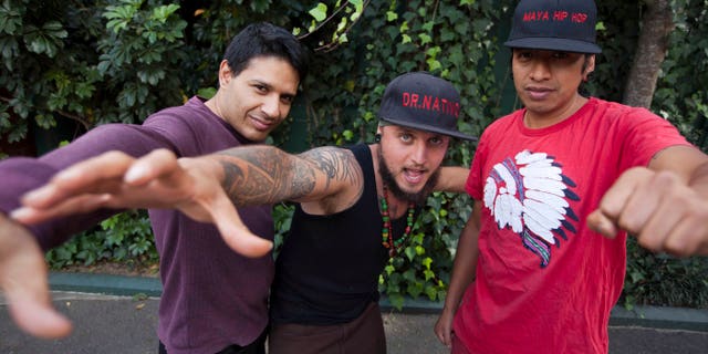 In this Feb. 5, 2015 photo, musicians from the band "Balam Ajpu," from left, Danilo Rodriguez, Juan Martinez a.k.a. "Dr. Native," and Rene Dionisio a.k.a. Tz´utu Baktun Kan pose for photos at a recording studio in Guatemala City. The band, whose name means Jaguar Warrior or Warrior of Light, raps in the ancient Mayan Tz'utujil language with the goal of making it cool for kids and teaching them their ancestorsâ stories and ways. (AP Photo/Moises Castillo)