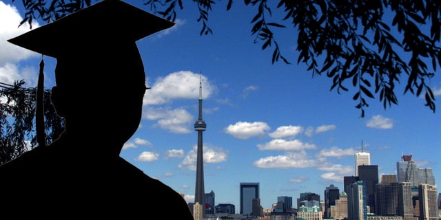 391776 02: (FILE PHOTO) The CN Tower and the Skydome highlight the Toronto skyline in his undated file photo. The International Olympic Committee (IOC) meets in Moscow July 13, 2001 to decide between front runners Beijing, Paris and Toronto for the site of the 2008 summer Olympics. (Photo by Carlo Allegri/Getty Images)