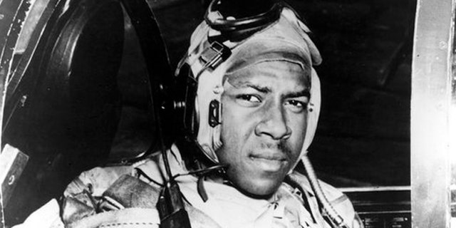 Jesse Brown in the cockpit of an F4U-4 Corsair fighter at an unidentified location in 1950.