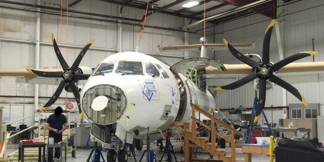 This photo provided by the Justice Department, taken in April 2015, shows a Drug Enforcement Agency (DEA) ATR 42-500 at the Defense Department's subcontractor's facility. A specialized plane at the DEA to fly missions in Afghanistan that has cost taxpayers $86 million has remained grounded for seven years. The Justice Department inspector general issued a scathing audit Wednesday, March 30, 2016, spurred by a July 2014 whistleblower’s report. (Justice Department via AP)
