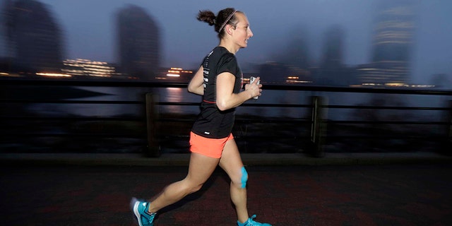 Amelia Gapin, a trangender woman, works out while preparing to run the Boston Marathon.