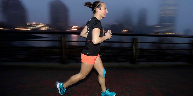 Amelia Gapin, a trangender woman, works out while preparing to run the Boston Marathon.