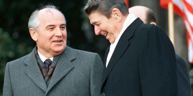 President Ronald Reagan stands with Soviet leader Mikhail Gorbachev at the White House, Dec. 8, 1987.