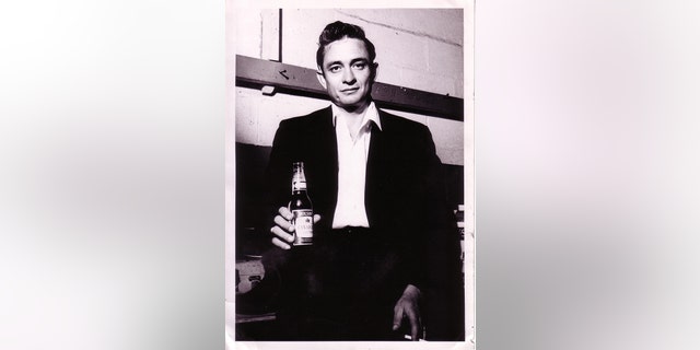 Johnny Cash with a Molson Canadian backstage in London, Ontario, 1958.