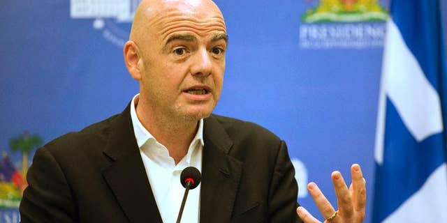 FILE - In this Saturday, April 29, 2017 file photo, FIFA President Gianni Infantino gives a press conference at the National Palace in Port-au-Prince, Haiti. An accelerated process to hand North America the 2026 World Cup is set to be approved by soccer leaders this week, with FIFA President Gianni Infantino hoping for a "bulletproof" process to avoid past voting scandals. The United States, Canada, and Mexico are seeking an unchallenged path to co-hosting rights for the 2026 showpiece, if FIFA's technical requirements are met by next year "It's an interesting, original proposal and we will discuss it tomorrow at the council and present the recommendation to the congress," Infantino told The Associated Press on Monday, May 8, 2017 .(AP Photo/Dieu Nalio Chery, file)