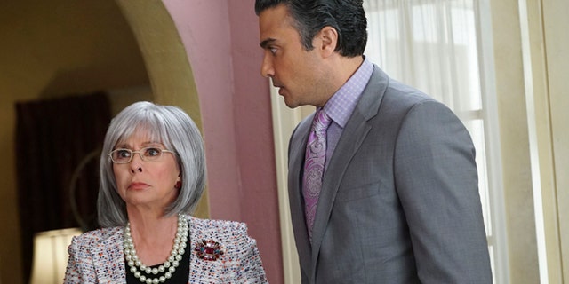This photo provided by The CW shows, Rita Moreno, left, as Liliana, and Jaime Camil as Rogelio, in the episode Chapter Eighteen, of the television series, "Jane the Virgin. Moreno guest stars on the Monday April 13, 2015 episode playing a difficult grandmother. (AP Photo/The CW, Danny Feld) MANDATORY CREDIT: NO SALES; NO ARCHIVES; NORTH AMERICA USE ONLY.