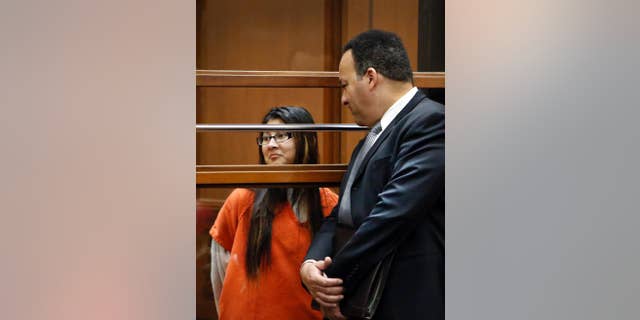 FILE - In this Jan. 12, 2015, file photo, Alejandra Guerrero, left, appears in Los Angeles Superior Court with her attorney Errol Cook, right. Guerrero was found guilty of first-degree murder and other charges Thursday, Oct. 13, 2016, in the beating death of a Chinese graduate student at the University of Southern California as he walked home after a late-night study session. Guerrero was the first of four people to be tried in the slaying of 24-year-old Xinran Ji during a robbery attempt in 2014. (Al Seib /Los Angeles Times via AP, Pool, File