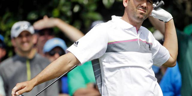 Sergio Garcia, of Spain, watches his tee shot on the ninth hole during the second round of the Masters golf tournament Friday, April 11, 2014, in Augusta, Ga. (AP Photo/Darron Cummings)