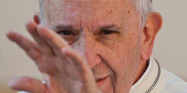 Pope Francis waves to the faithful as he arrives for his weekly general audience, in St. Peter's Square, at the Vatican, Wednesday, Sept. 28, 2016. (AP Photo/Andrew Medichini)