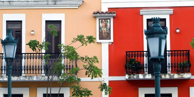 SAN JUAN, PUERTO RICO- APRIL 26: Colorful homes line the cobblestoned streets April 26, 2004 in Old San Juan, the original capital city of San Juan, Puerto Rico. The old city is a historic district of seven square blocks made up of ancient buildings and colonial homes, massive stone walls and vast fortifications, sunny parks and cobblestoned streets. (Photo by Joe Raedle/Getty Images)