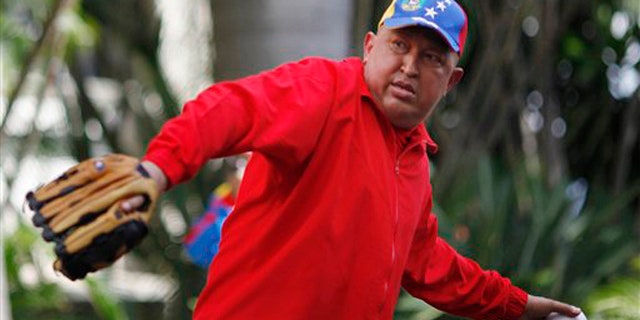 In this photo released by Miraflores Press Office, Venezuela's President Hugo Chavez throws a softball after giving a live address on state TV at Miraflores presidential palace in Caracas, Venezuela, Thursday Sept. 29, 2011.