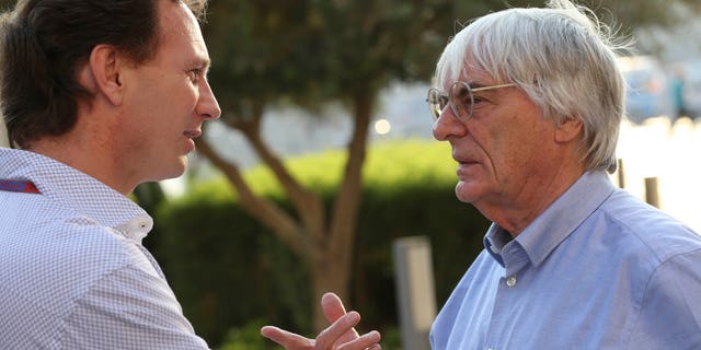 FILE - In this Thursday, Nov. 1, 2012 file photo, Red Bull team principal Christian Horner, left, talks with Bernie Ecclestone, president and CEO of Formula One Management, at the Yas Marina racetrack in Abu Dhabi, United Arab Emirates. With Ecclestone's Formula One future in doubt amid bribery allegations, one of the most influential team bosses on Wednesday, Jan. 15, 2014 said the series' prosperity relies on him remaining in charge. Christian Horner, team principal of reigning constructors' champion Red Bull, believes Ecclestone is "the only guy" who can ensure F1 maintains its global reach as the premier motorsport series. (AP Photo/Luca Bruno, File)