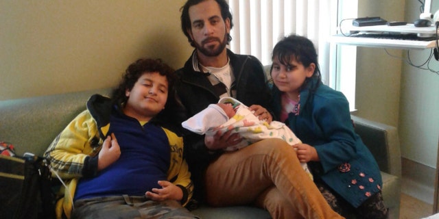Zarif Kelada, center, was put on life support after suffering a heart attack when he confronted two teen robbers.