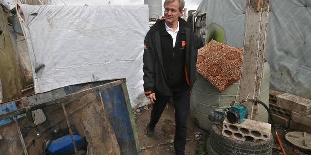 FILE- In this Wednesday, Feb. 25, 2015 file photo, Jan Egeland, the secretary general of the Norwegian Refugee Council and former U.N. humanitarian chief, walks between tents at a Syrian refugee camp in the town of Marej in the Bekaa valley, east Lebanon. Egeland, one of the mediators who helped broker the 1993 Oslo Peace Accord, remembered Shimon Peres as a charismatic leader who saw peace with the Palestinians as key to Israel’s future, as he told The Associated Press by phone on Wednesday, Sept. 28, 2016. (AP Photo/Hussein Malla, File)