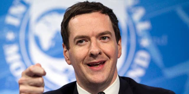 FILE - This is a Thursday, April 14, 2016 file photo of Britain's Chancellor of the Exchequer George Osborne while speaking at a news conference during the the G5 Ministers of Finance meeting during the World Bank/IMF Spring Meetings in Washington. Britain's Treasury says house prices could fall by up to 18 percent if the country leaves the European Union — a claim dismissed as scaremongering by campaigners for a U.K. exit from the bloc. ( AP Photo/Jose Luis Magana, File)