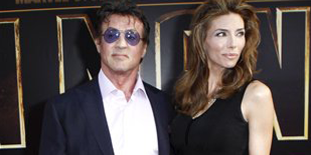 Actor Sylvester Stallone and, wife, Jennifer Flavin arrive for the world premiere of "Iron Man 2" at El Capitan Theatre in Los Angeles on Monday, April 26, 2010. (AP Photo/Matt Sayles)