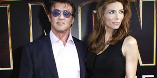 Actor Sylvester Stallone and, wife, Jennifer Flavin arrive for the world premiere of "Iron Man 2" at El Capitan Theatre in Los Angeles on Monday, April 26, 2010. (AP Photo/Matt Sayles)