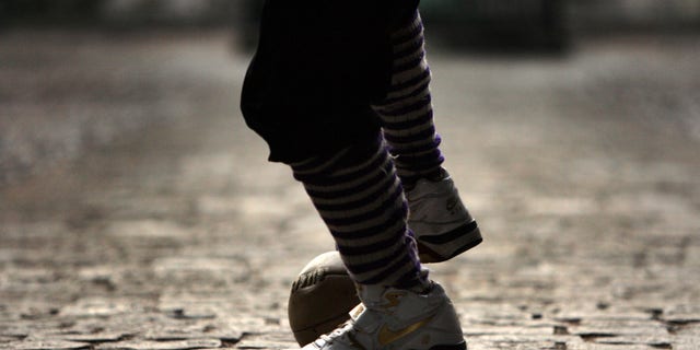 ETON, UNITED KINGDOM - NOVEMBER 17: A Wall Game ball sits on the cobbles of School Yard, ahead of a contest between the Collegers and the Oppidians of Eton College, Windsor, England, November 17, 2007. The origins of the game are lost in time but the first recorded game was in 1766 with competition between the two houses is as fierce as ever. The object of the game is to get the ball to either end of the wall and score a goal, which has not happened since 1909. As well as scoring a goal the players can win points with a 'shy' where the ball is held against the wall and touched by the hand and awarded one point. (Photo by Christopher Furlong/Getty Images)
