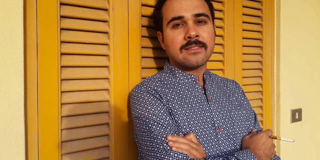 FILE - In this undated file image Egyptian author Ahmed Naji poses for a photo in Cairo, Egypt. Naji on Thursday, Dec. 22, 2016, has walked out of a Cairo police station, after a court suspended his two-year-sentence pending review of his appeal on obscenity charges. (Yasmin Hosam El Din via AP, File)